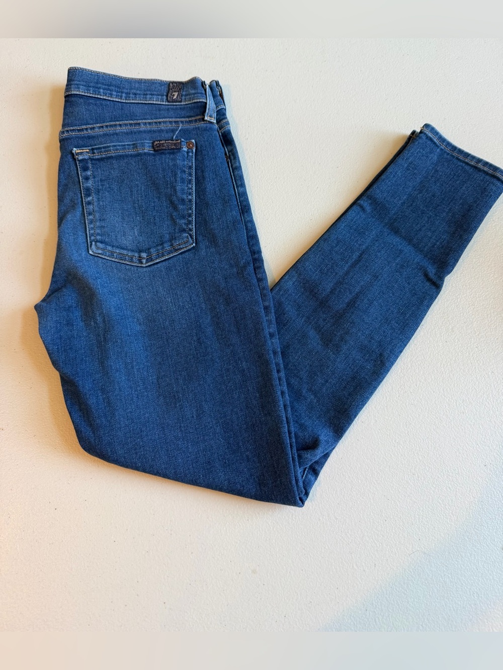 7 For All Mankind The Ankle Skinny Like New Size Med Wash Blue. Distressed knees